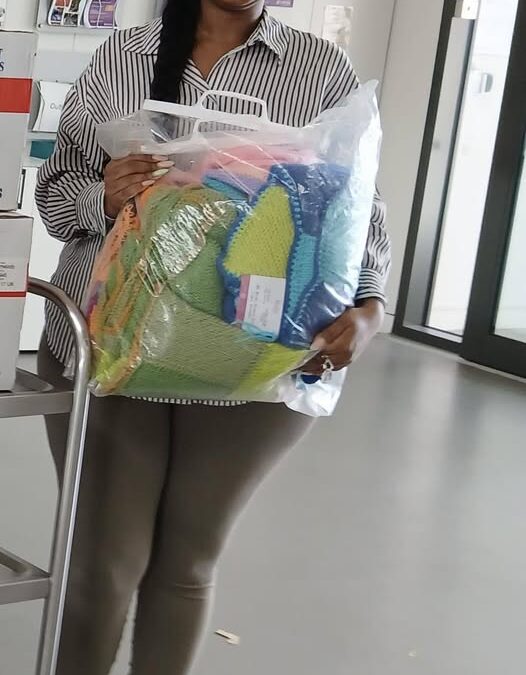 D10 Royal Forest of Dean Hamlin Fistula office in Birmingham receive knitted blankets