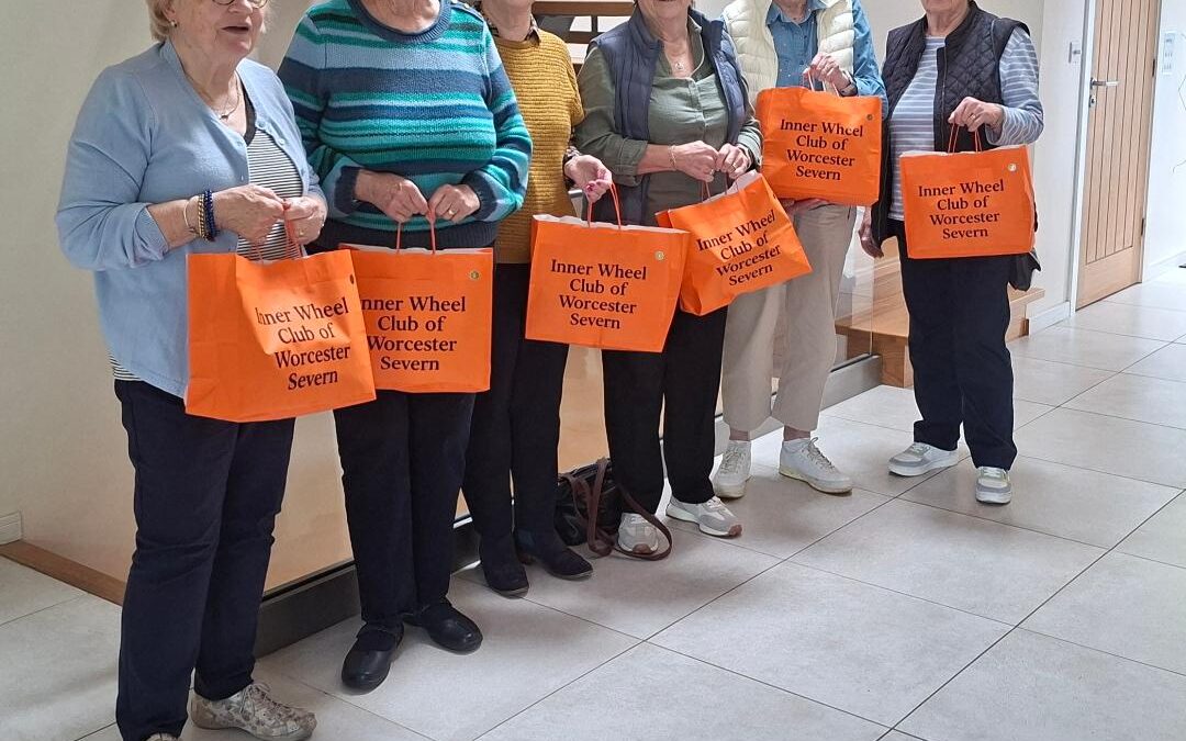 D10 – Worcester Severn present orange bags to Women’s Aid Worcester