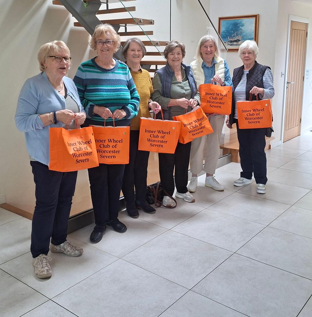 D10 – Worcester Severn present orange bags to Women’s Aid Worcester